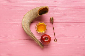 Honey with apple and shofar on color wooden background. Rosh hashanah (Jewish New Year) celebration