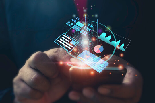 A man use smart phone for analyzing graph for data management to make report.Financial technology,Laptop ,many graphs.Investment.Photo concept of Data analyst and financial.