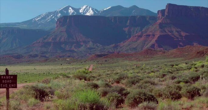 Aerial: Lonely dirt road in Castle Valley. Moab, Utah, USA