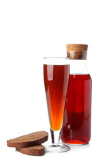 Glass and bottle of fresh kvass on white background