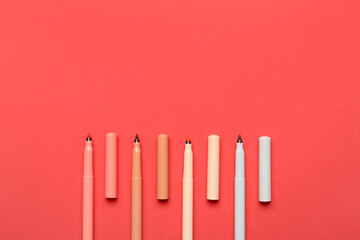 Colorful markers on color background