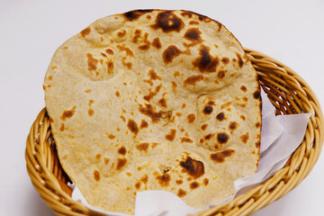 tandoori naan bread or roti in a basket, indian clay oven baked bread - obrazy, fototapety, plakaty