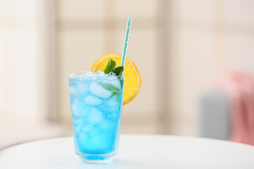 Glass of Blue Lagoon cocktail on table