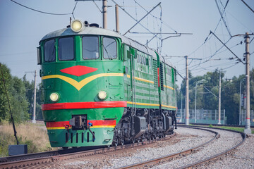 Fototapeta na wymiar Retro diesel locomotive approaches to the station.