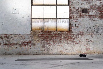 warehouse window with yoga mat for yoga practice