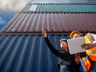 businesswoman and Shipper male talk work job career report tablet is pointing finger agreement...