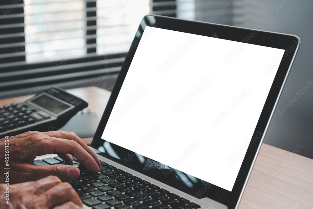 Poster businessman working in office interior on laptop computer on desk, office person using laptop comput