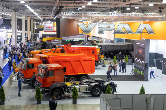 New trucks and dump trucks Ural in the exhibition pavilion. Ural stand at the International Commercial Vehicles Show Comtrans 2021. Moscow, Russia - September 7-11, 2021