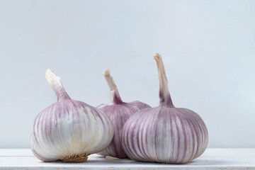 Garlics bulbs on white background.