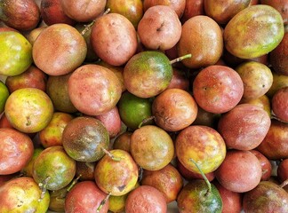 Organic, locally grown, healthy passion fruit at the fruit and vegetable market, ripe and ready for eating