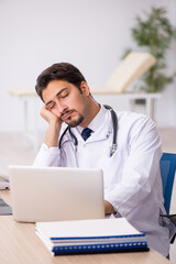 Young male doctor working in the clinic