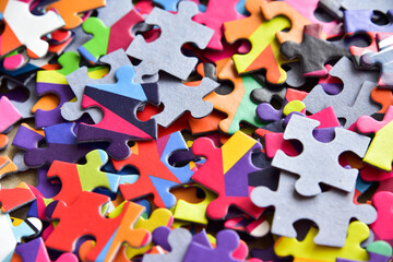closeup heap of colorful jigsaw puzzle game