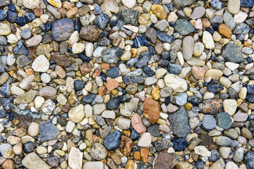 Rocks sea beach or stones background, Top view many small stones in assorted colors, Abstract rough wallpaper nature concept