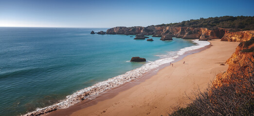 Atlantic coast in Algarve, Portugal. Beautiful bright landscape, waves and rocks on the beach - Powered by Adobe