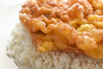 Thai omelette with rice and cucumber. Popular and traditional Thai food.