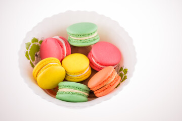 Multi coloured macarons on white