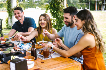 Group of latin friends eating mexican food in the restaurant terrace in Mexico Latin America