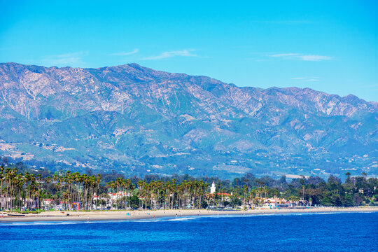 Scenic view of Santa Barbara beach from Stearns Wharf. Slopes of Santa Ynez Mountains range in background