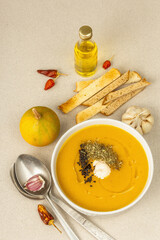 Pumpkin cream soup. Traditional autumn food. Hot dish, ripe vegetables, fragrant spices