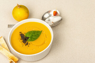 Pumpkin cream soup. Traditional autumn food. Hot dish, ripe vegetables, fragrant spices