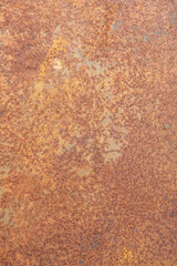 Surface of the steel plate is rusted. orange and brown color.