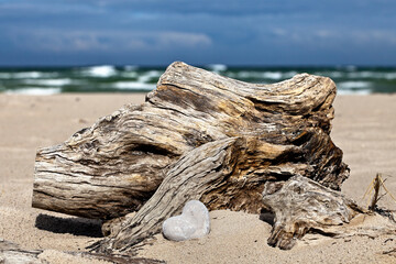 Fototapeta premium Grey Stone Heart And Driftwood