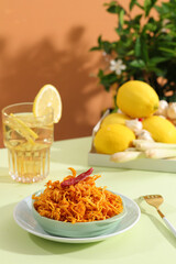 Dried spicy shredded chicken meat  or another name Kho ga, is a traditional Vietnamese. The meat chicken is shredded with some chilly, lemon leaf, garlic and dried onion on light green table. Topview
