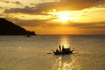 TRADITIONAL FISHERMEN GOING NIGHT NET FISHING IN THEIR BANKA BOAT FROM TALAPANAN VILLAGE THE PHILIPPINES