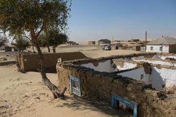 Aralsk, Kazakhstan - 10.05.2020 : Abandoned and dilapidated walls of houses on the territory of the...