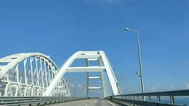 Beautiful view of the Crimean bridge from the car window on a sunny day.