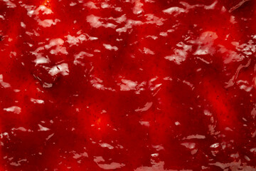 Background texture of delicious berry jam with fruit chunks
