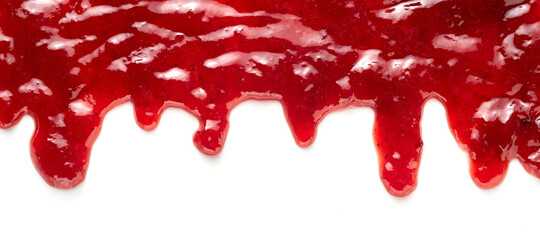 Top border of dripping fresh strawberry jam on white