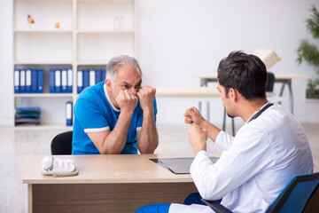 Old male patient visiting young male doctor