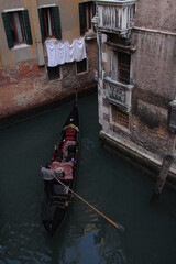 Fototapeta na wymiar Venice, Italy People enjoying a ride in a gondola in Venice.
