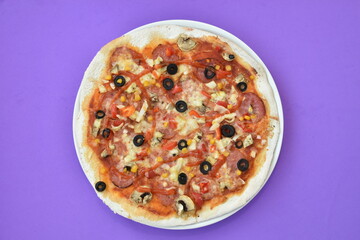 Pizza four friends, with olives and salami