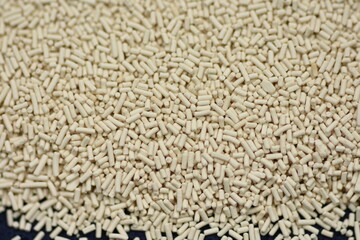 Pile of dry yeast isolated ,macro detail