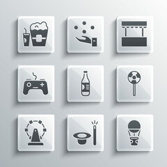 Set Magic hat and wand, Hot air balloon, Lollipop, Bottle of water, Ferris wheel, Gamepad, Popcorn in box glass and Ticket office icon. Vector