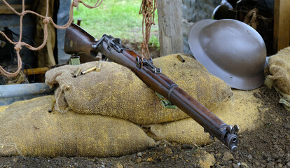 The Lee–Enfield is a bolt-action, magazine-fed repeating rifle that served as the main firearm of the military forces of the British Empire and Commonwealth during the first half of the 20th century,. - obrazy, fototapety, plakaty