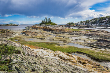 Rocky shoreline on the St Lawrence river near Raguneau in Cote Nord of Quebec, Canada