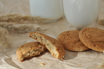 oatmeal cookies and oats on a brown background