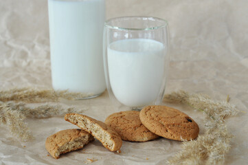 glass of milk and oatmeal cookies