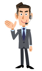 手のひらで案内するヘッドセットを装着した男性オペレーター
