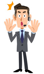 驚くヘッドセットを装着した男性オペレーター
