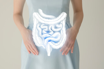 Woman in blue clothes holding virtual intestine in hand. Handrawn human organ, detox and healthcare, healthcare hospital service concept stock photo - obrazy, fototapety, plakaty