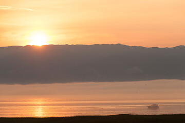 golden misty sunset, beautiful yellow evening landscape on the sea