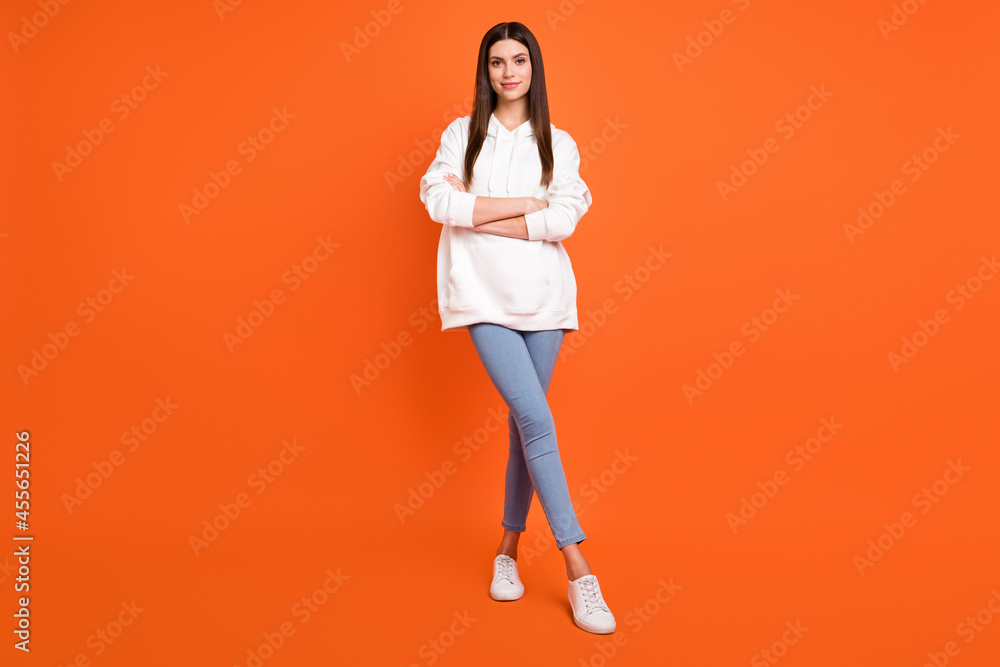 Canvas Prints Full length body size view of attractive cheery girl folded arms making step isolated over bright orange color background