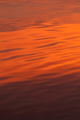 red reflection in water, metallic red water, abstract background
