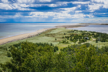 Fototapeta na wymiar View on Portneuf sur Mer sandbank from a nearby observation deck, in Cote Nord of Quebec, Canada