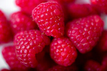 Fresh juicy raspberries on black background.  Summer berries.