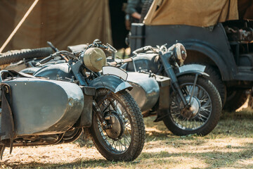 Fototapeta na wymiar World War II German Wehrmacht Old Tricars, Three-wheeled Motorcycles in Camp